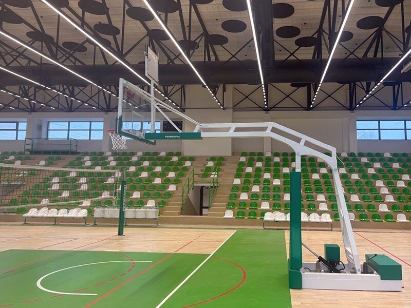 Professional basketball equipment and tribunes in a sports hall